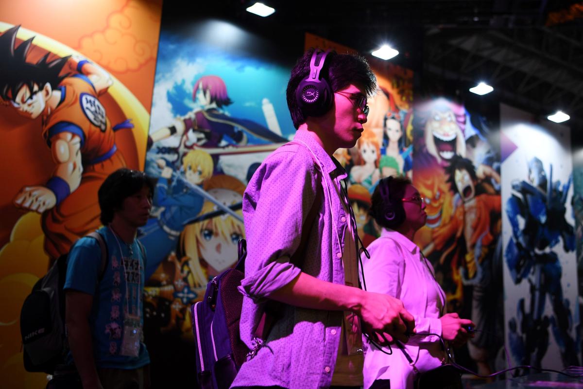 People play video games during the Tokyo Game Show in Makuhari, Chiba Prefecture. The exhibition, which opens on September 23, 2020 in an online format, showcases Japanese video games and is still regularly thronged by enthusiastic gamers, attracting more than 200,000 people over four years on average in recent years. Credit: AFP Photo
