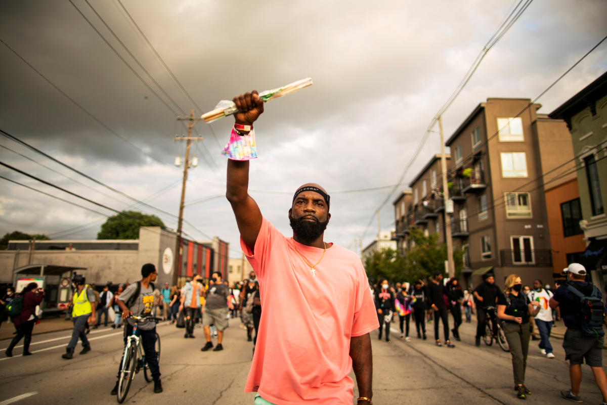 Demonstrators march after a grand jury decided not to bring homicide charges against police officers involved in the fatal shooting of Breonna Taylor in her apartment, in Louisville, US. Credit: Reuters Photo