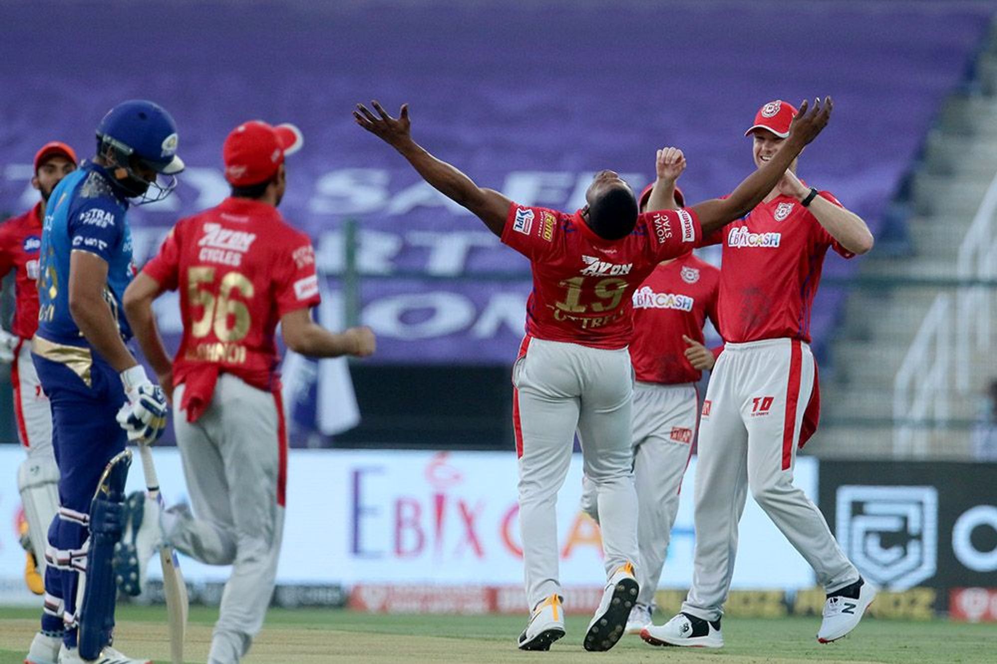 Sheldon Cottrell of Kings XI Punjab celebrates the wicket of Quinton de Kock of Mumbai Indians during the IPL 2020 match. Credit: iplt20.com, BCCI