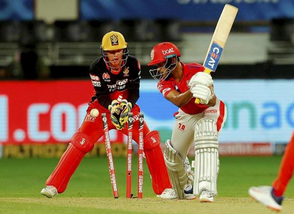 Kings XI Punjab batsman Mayank Agarwal bowled by RCB spinner Yuzvendra Chahal during IPL 2020 cricket match against Royal Challengers Bangalore, at Dubai International Cricket Stadium in Abu Dhabi. Credit: PTI Photo