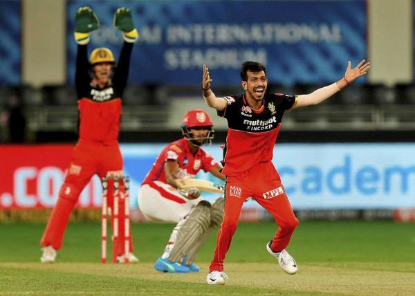 Kings XI Punjab batsman Mayank Agarwal bowled by RCB spinner Yuzvendra Chahal during IPL 2020 cricket match against Royal Challengers Bangalore. Credit: PTI Photo