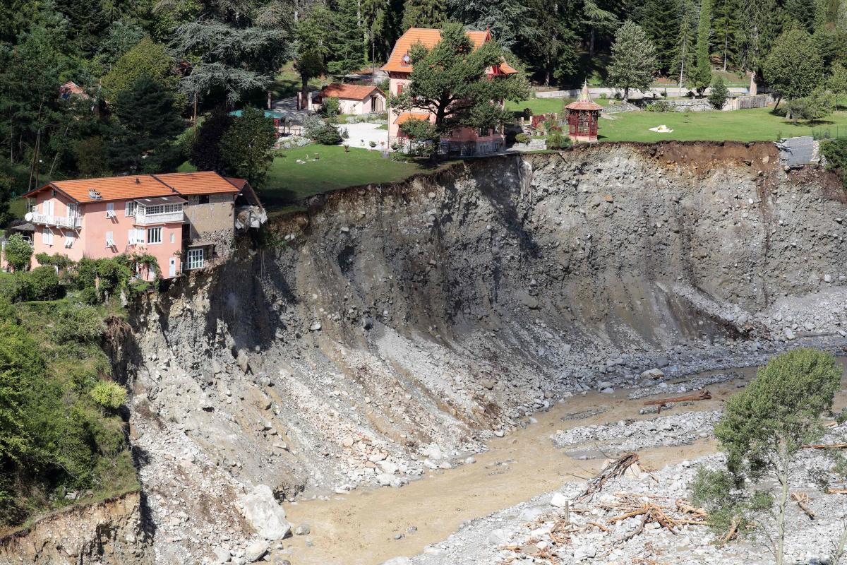 In Saint-Martin-Vesubie, near Nice, the devastating floods at the beginning of October destroyed an entire section of the cemetery, leaving a gaping void. Credit: AFP Photo