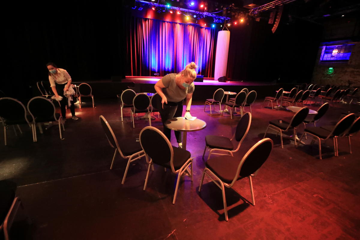 Waitresses of the Bonn Pantheon, one of Germany's most prestigious revue theatres clean and disinfect the tables in the empty hall following the next to last cabaret performance before a one month lock-down in Germany due to the spread of the coronavirus disease outbreak in Bonn, Germany. Credit: Reuters Photo