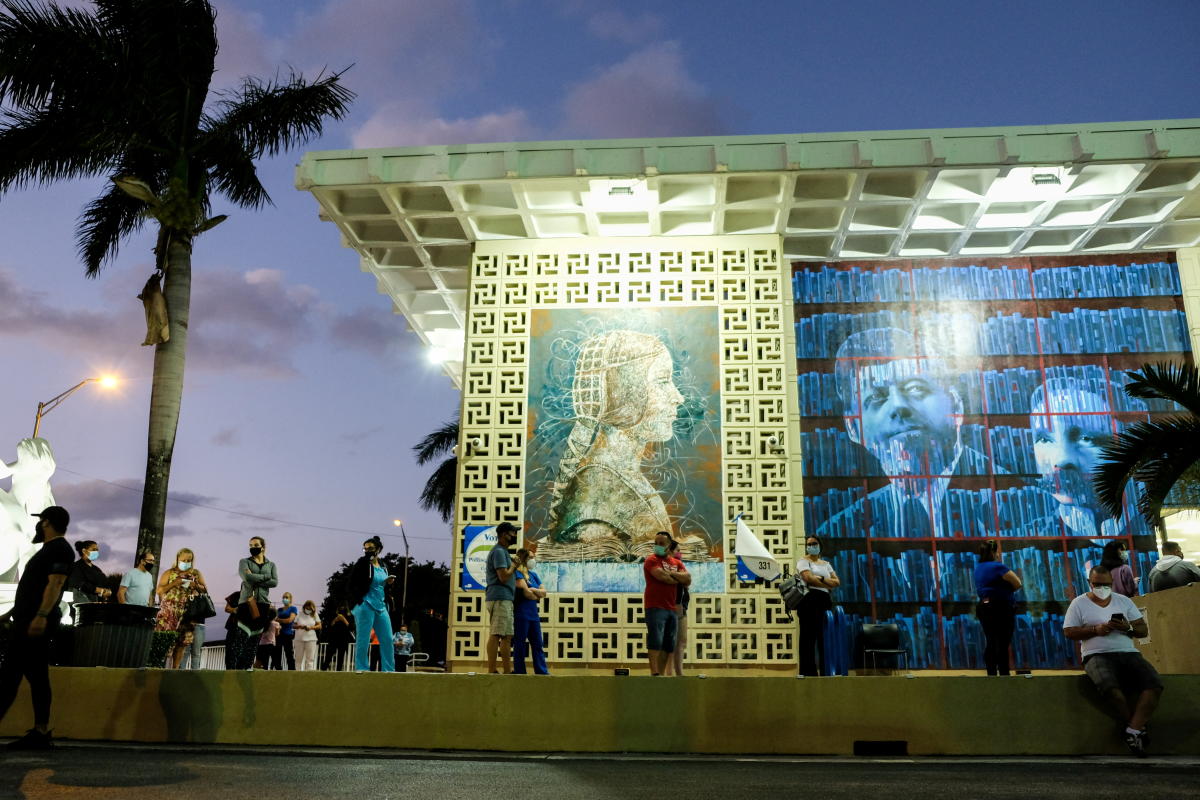 Voters line up at the John F Kennedy Library, a Miami-Dade County polling station, during the 2020 US presidential election in Miami, Florida, US. Credit: Reuters Photo