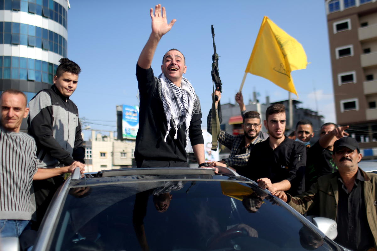 Freed Palestinian prisoner Abdel-Raouf Qe'dan, who has been released after serving a 16-year-sentence in an Israeli jail, waves upon arrival in Rafah in the southern Gaza Strip. Credit: Reuters Photo