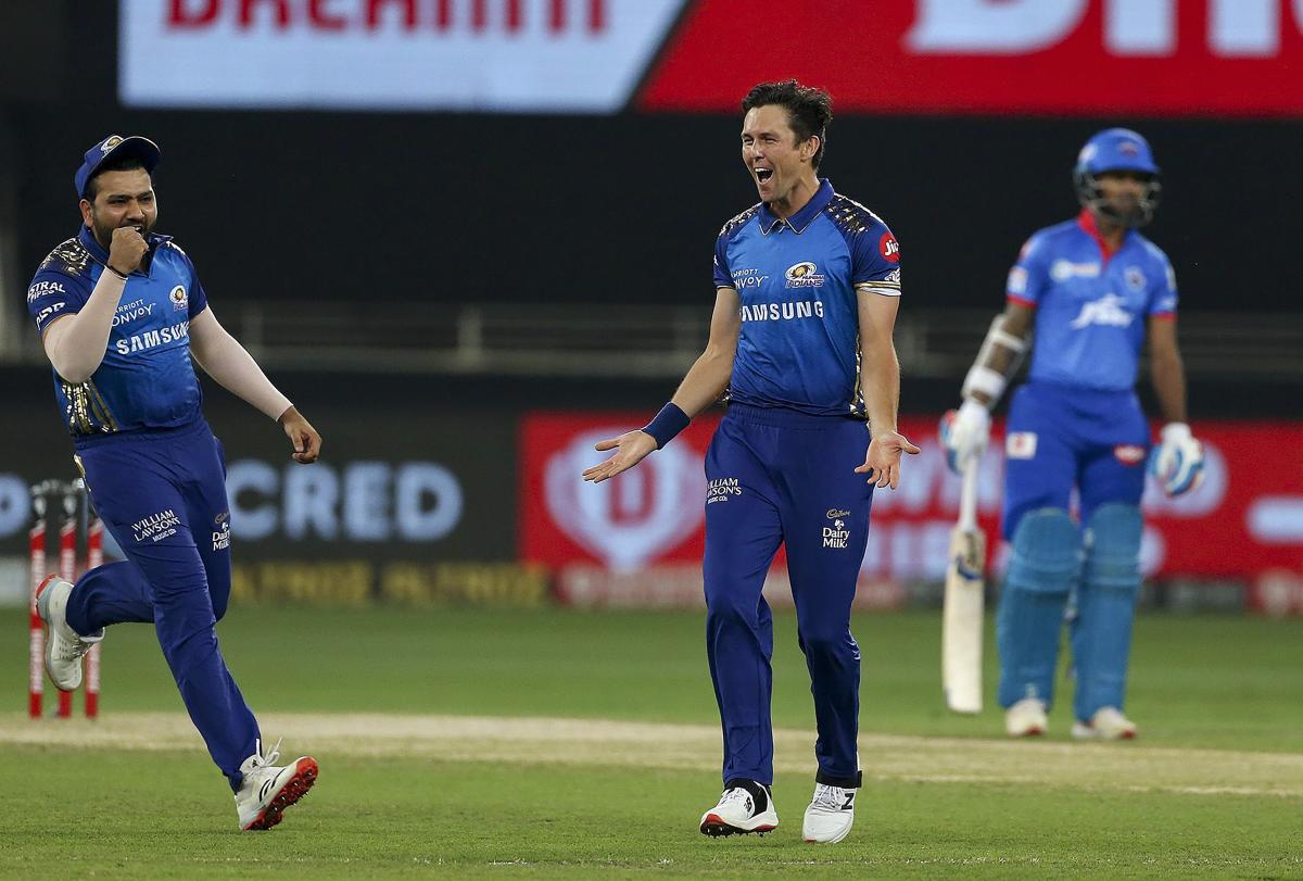 Mumbai Indians player Trent Boult celebrates the wicket of Delhi Capitals batsman Marcus Stoinis. Credit: PTI Photo