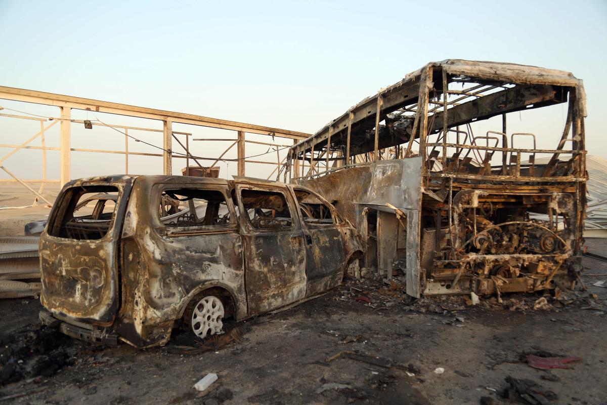 2. Iraq | Burnt out vehicles after gunmen and suicide car bombers killed dozens of people in two assaults claimed by Islamic State (IS) group jihadists near the southern Iraqi city of Nasiriyah on September 14, 2017. The attackers struck at midday, opening fire on a restaurant before getting into a car and blowing themselves up at a nearby security checkpoint, officials said. Credit: AFP Photo