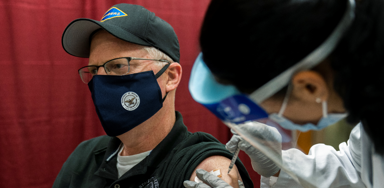 Acting US Defense Secretary Christopher Miller, gets his first shot of the Pfizer-BioNTech Covid-19 vaccine, administered by HN Samantha Alvarez, at the Walter Reed National Military Medical Center in Bethesda. Credit: Reuters