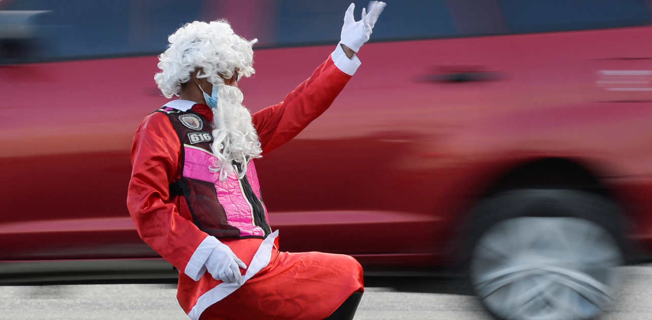Traffic enforcer Ramiro Hinojas wears a Santa Claus costume while directing motorists at an intersection, in Pasay City, Metro Manila, Philippines. Credit: Reuters
