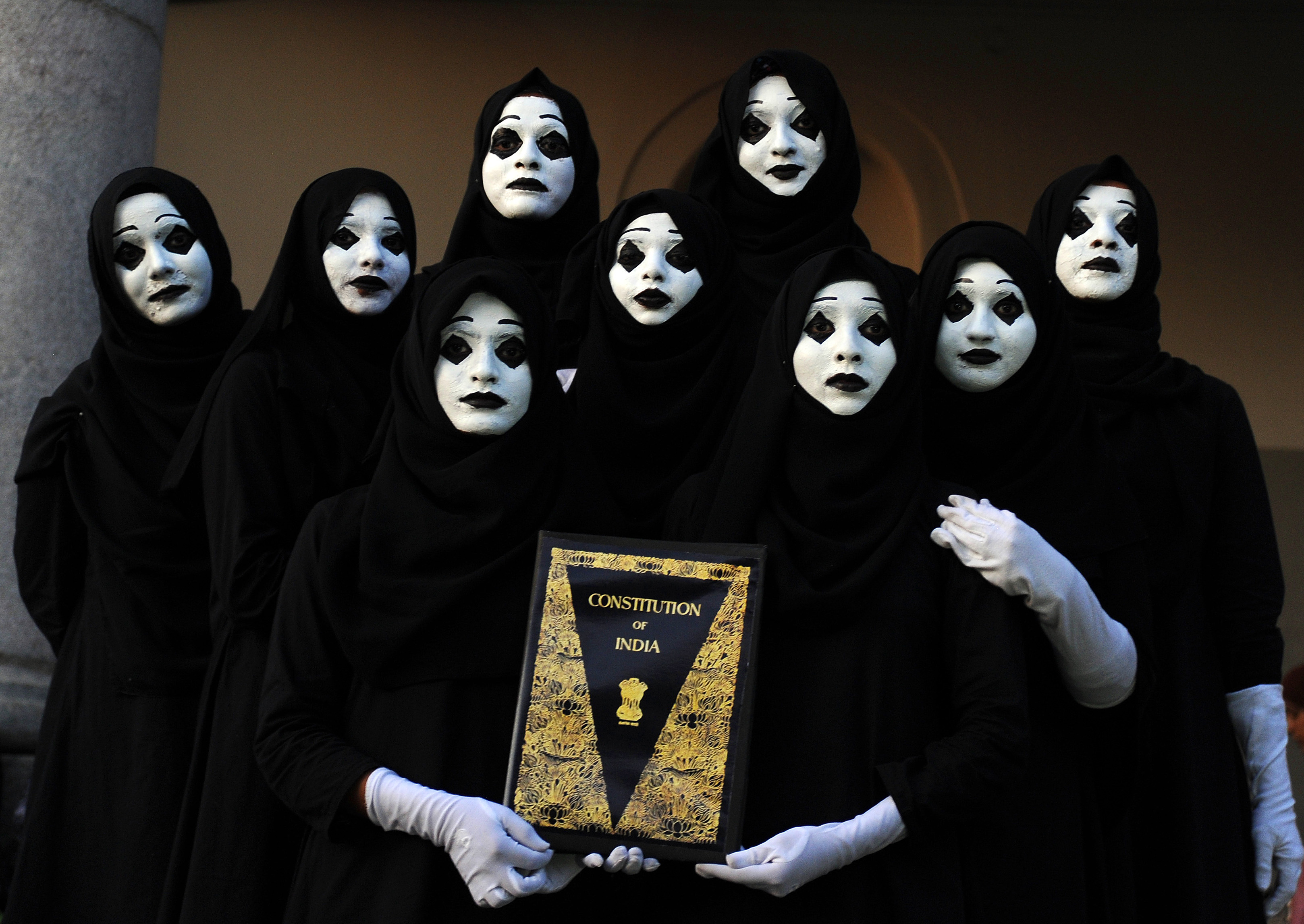 Before the lockdown, voices grow loud | While a pandemic-induced lockdown came into effect in March, there was no dearth of protests. Protests against the CAA and NRC spilled over from 2019. Protesters dressed as mime artists hold the Constitution of India book during the protest against CAA/NRC at Town Hall in Bengaluru. Credit: DH Photo/ Pushkar V