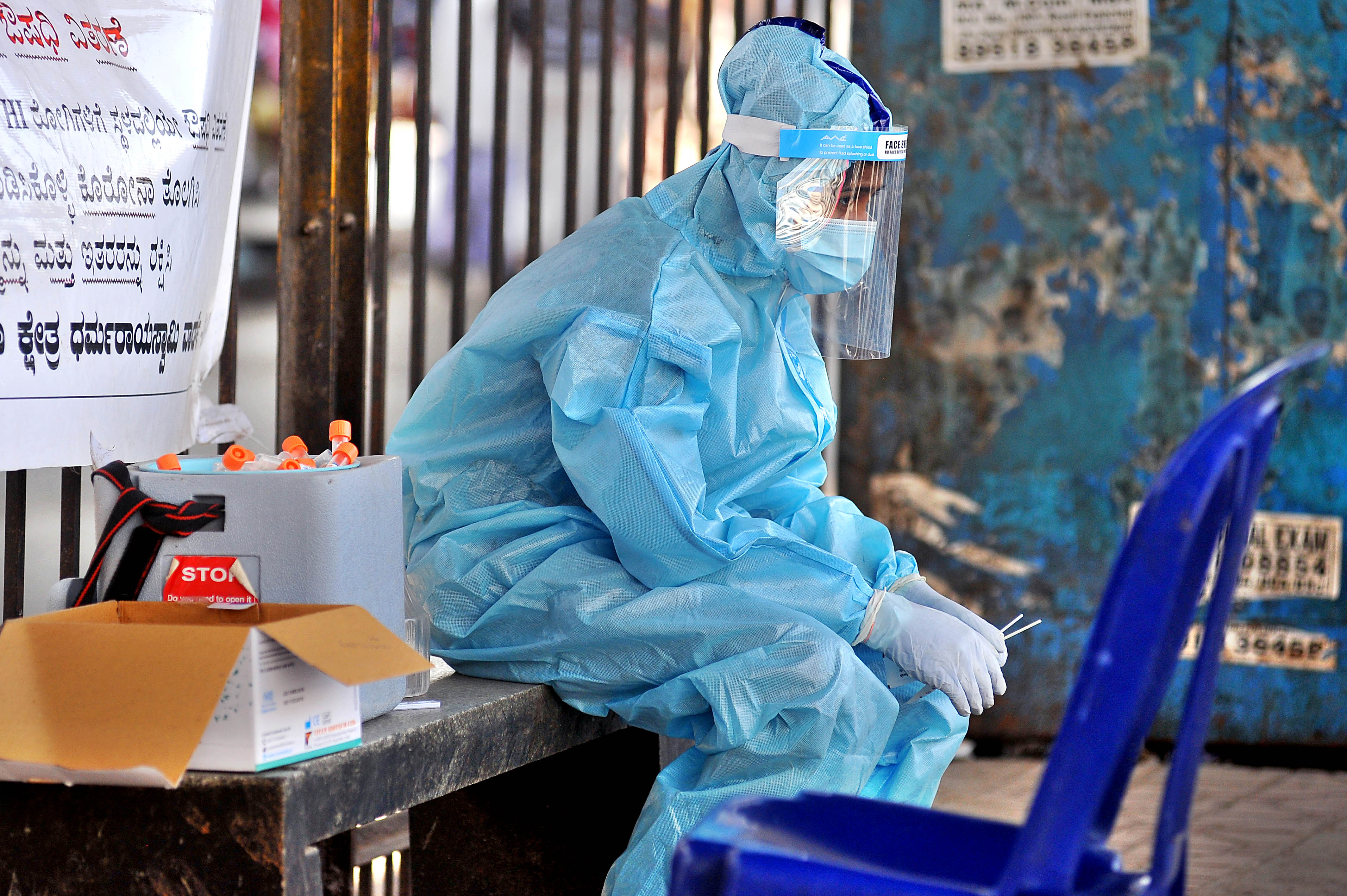 Karnataka sees virus resurgence | After the death of a 76-year-old man from Kalaburagi in the state, the country's first casualty to coronavirus, in March, the focus entirely shifted to containing the contagion. While a strict lockdown and containment strategy started yielding results, making Karnataka a better performer state, easing of restrictions and allowing public movement soon led to a deterioration in the situation. By September-October, Karnataka became one of the worst affected states with daily cases surging as high as over 10,000, even as related deaths started going north. A medical staff takes a break from collecting Covid-19 test samples. Credit: DH Photo/ Pushkar V