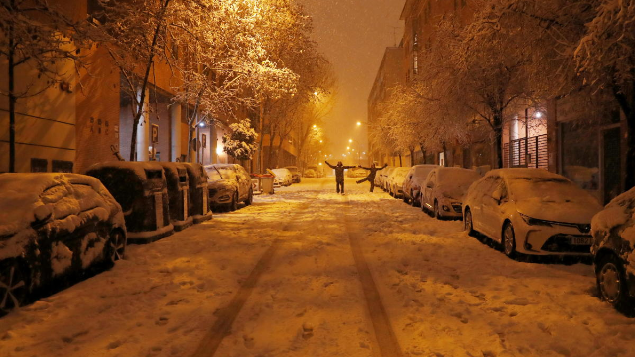 People enjoy themselves in the snow during a heavy snowfall in Madrid, Spain. Credit: Reuters Photo