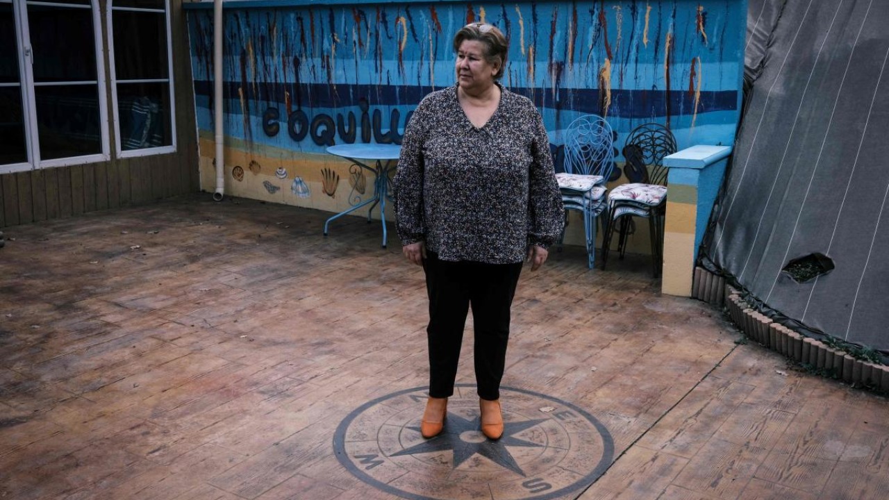 Jeanne Pouchain who, since November 2017, has been declared dead by the justice system after being convicted by the Prud'hommes, poses for a photograph on January 8, 2021, in Saint-Joseph. Credit: AFP.