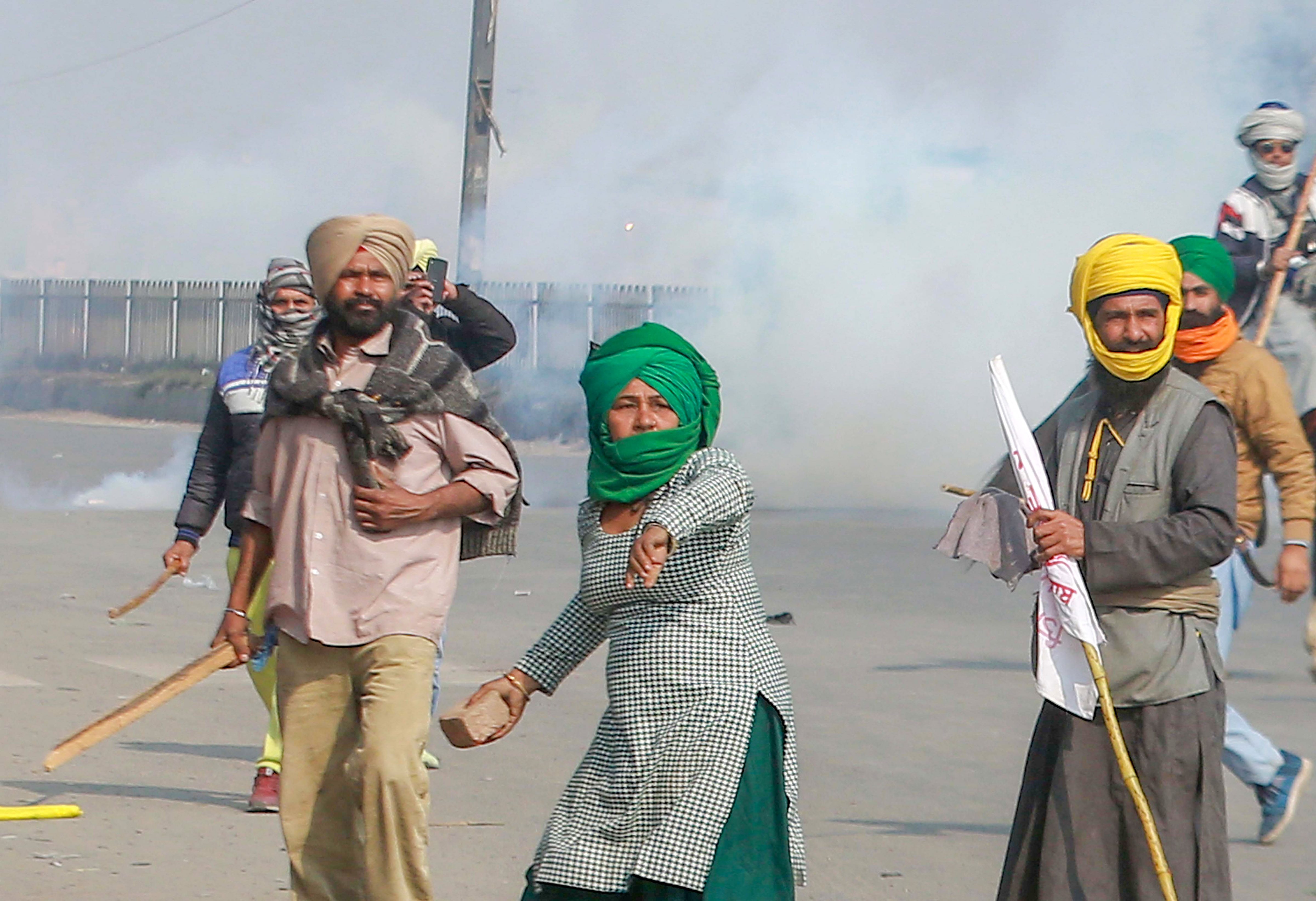 ITO resembled a war zone with a car being vandalised by angry protesters and shells, bricks and stones littering the wide streets, testimony to the fact that the farmer movement that had been peaceful for two months was no longer so. Credit: PTI