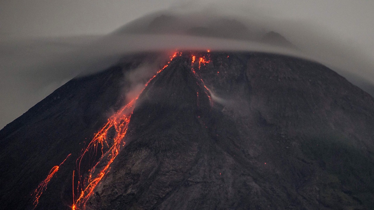 This long-exposure image shows lava flowing down from the crater of Mount Merapi, Indonesia's most active volcano, as seen from Sleman near the city of Yogyakarta early on March 5, 2021. Credit: AFP Photo
