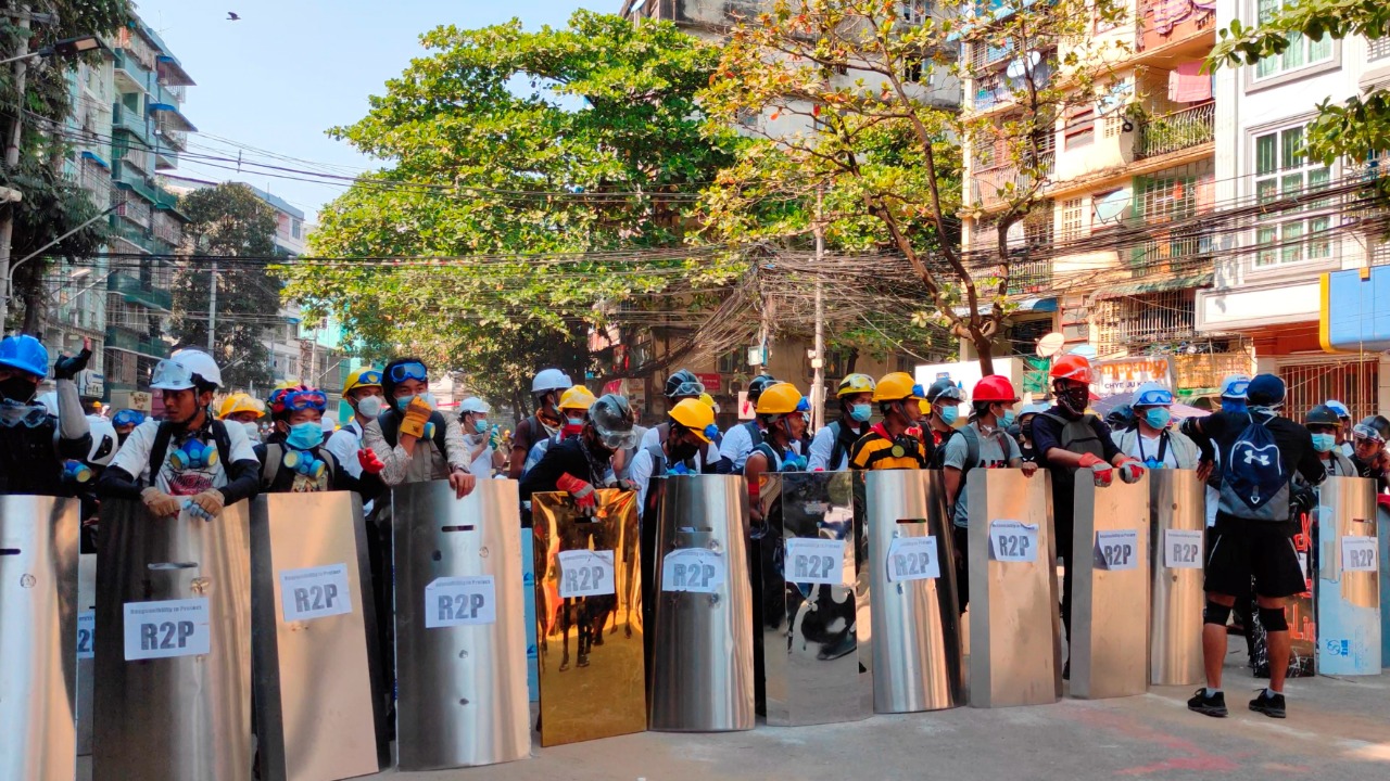 Protesters set up a makeshift shield formation in preparation for potential clashes, in Yangon, Myanmar. Credit: Reuters Photo
