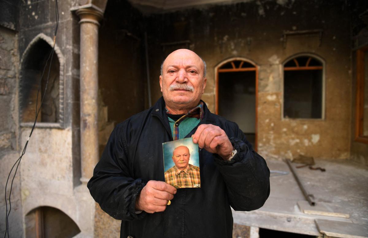 In the northern city of Aleppo, retaken by government forces from rebels in late 2018, Ahmed Nashawi posed in front of his destroyed house.  The man in his fifties, once one of the city's most popular fishmongers, said his home and shop were obliterated in clashes between rebels and pro-government fighters in 2015.
