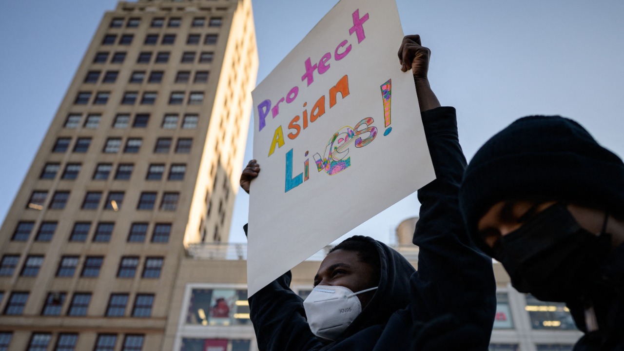 Members and supporters of the Asian-American community gather during a 'peace vigil' for victims of Asian attacks, at Union square in New York city. Credit: AFP Photo