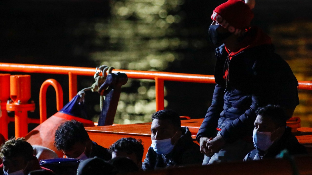 Migrants wait to disembark from a Spanish coast guard vessel, in the port of Arguineguin, in the south part of the island of Gran Canaria, Spain March 29, 2021. Credit: Reuters Photo