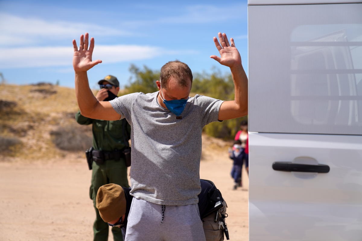 Asylum-seeking migrants cross the border from Mexico and are detained by CBP agents in Calexico, California, U.S. Credit: Reuters Photo