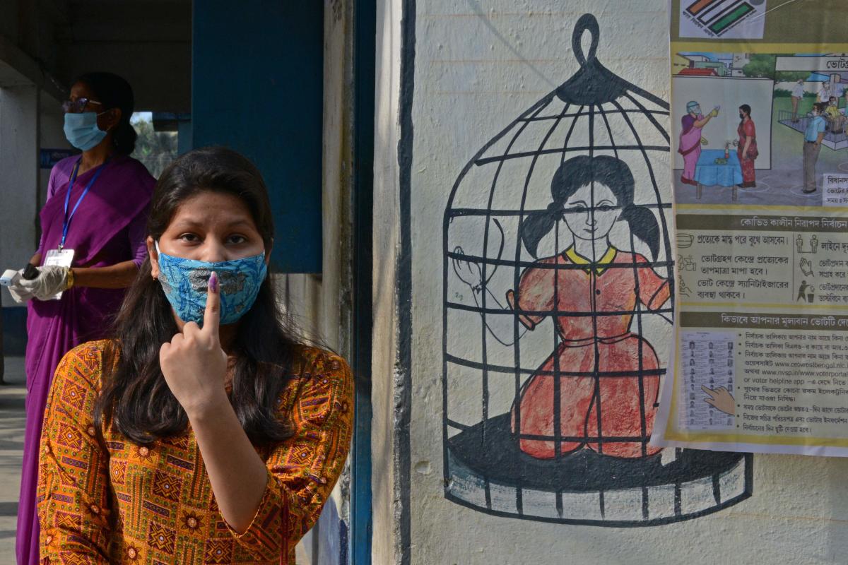 A first time voter shows her inked marked finger after casting vote at a polling station during the 6th phase of the West Bengal's state legislative assembly elections on the outskirts of Chopra in North Dinajpur district on April 22, 2021. Credit: AFP Photo
