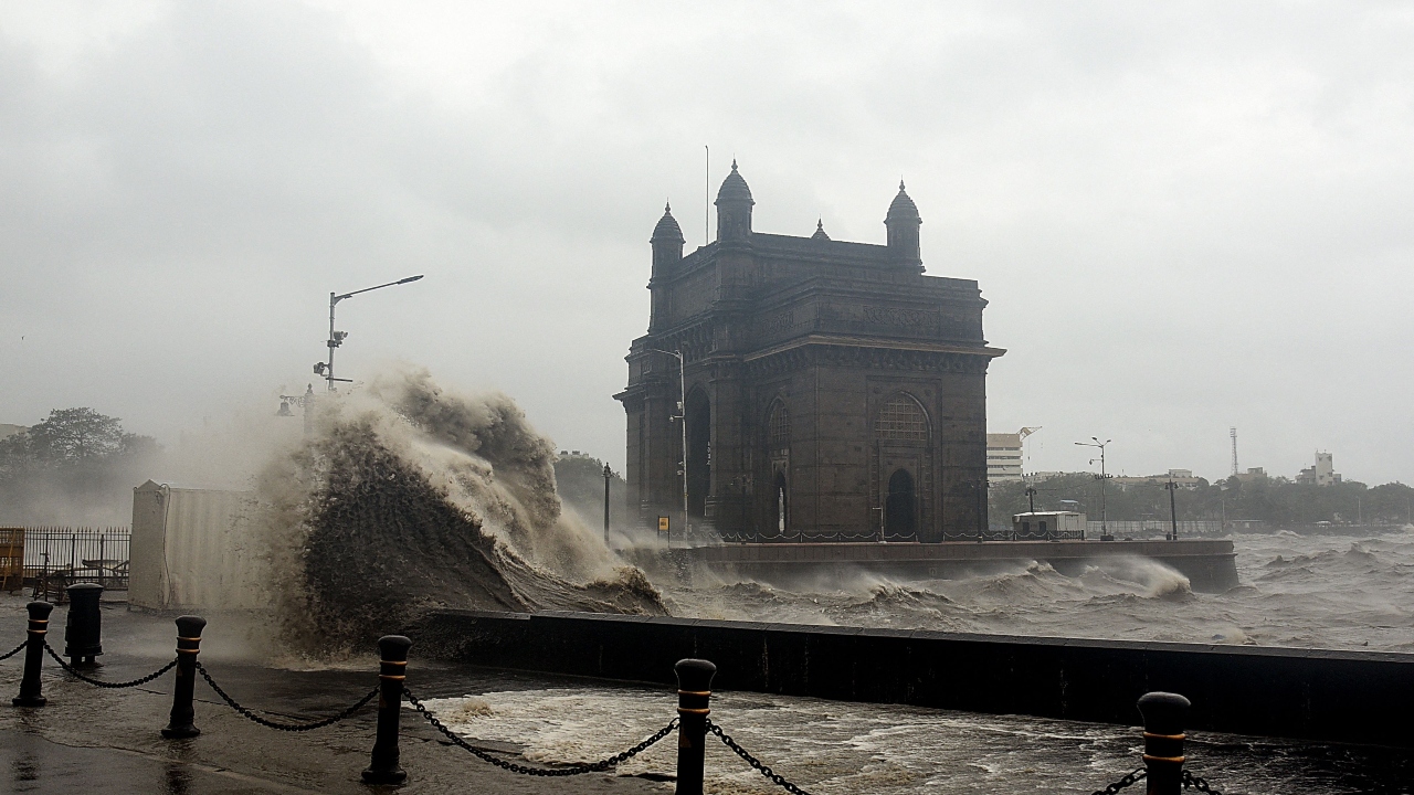 Sea waves rode the tarmac near the Gateway of India. Credit: AFP