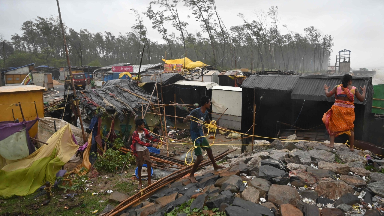 Cyclone Yaas flattened houses, uprooted trees, blew off roofs and destroyed tens of thousands of mud houses, while a storm surge inundated coastal villages in Odisha and West Bengal. Credit: AFP Photo