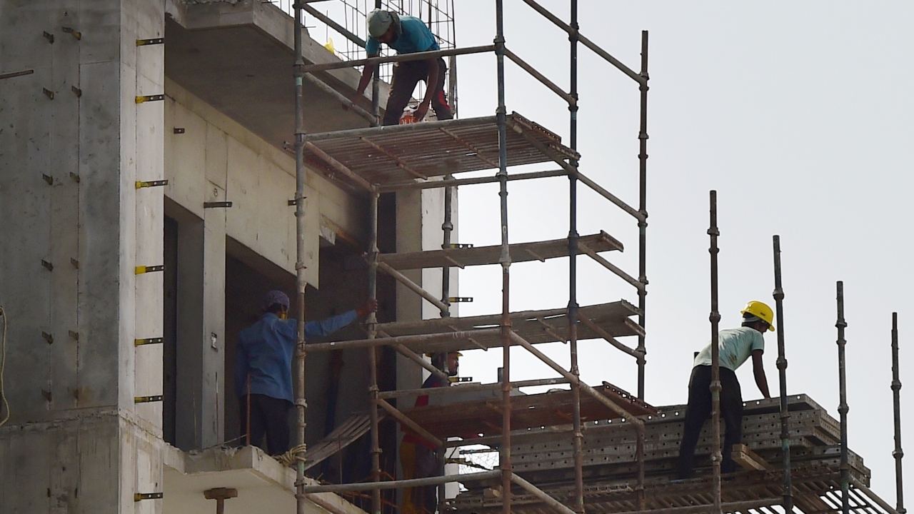 Labourers work at a construction site as unlocking process of lockdown begins in New Delhi. Credit: PTI Photo