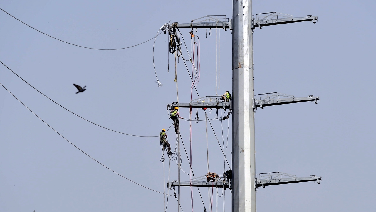 New power cables installed by lineworkers as unlock process of Covid-19 lockdown begins in New Delhi. Credit: PTI Photo