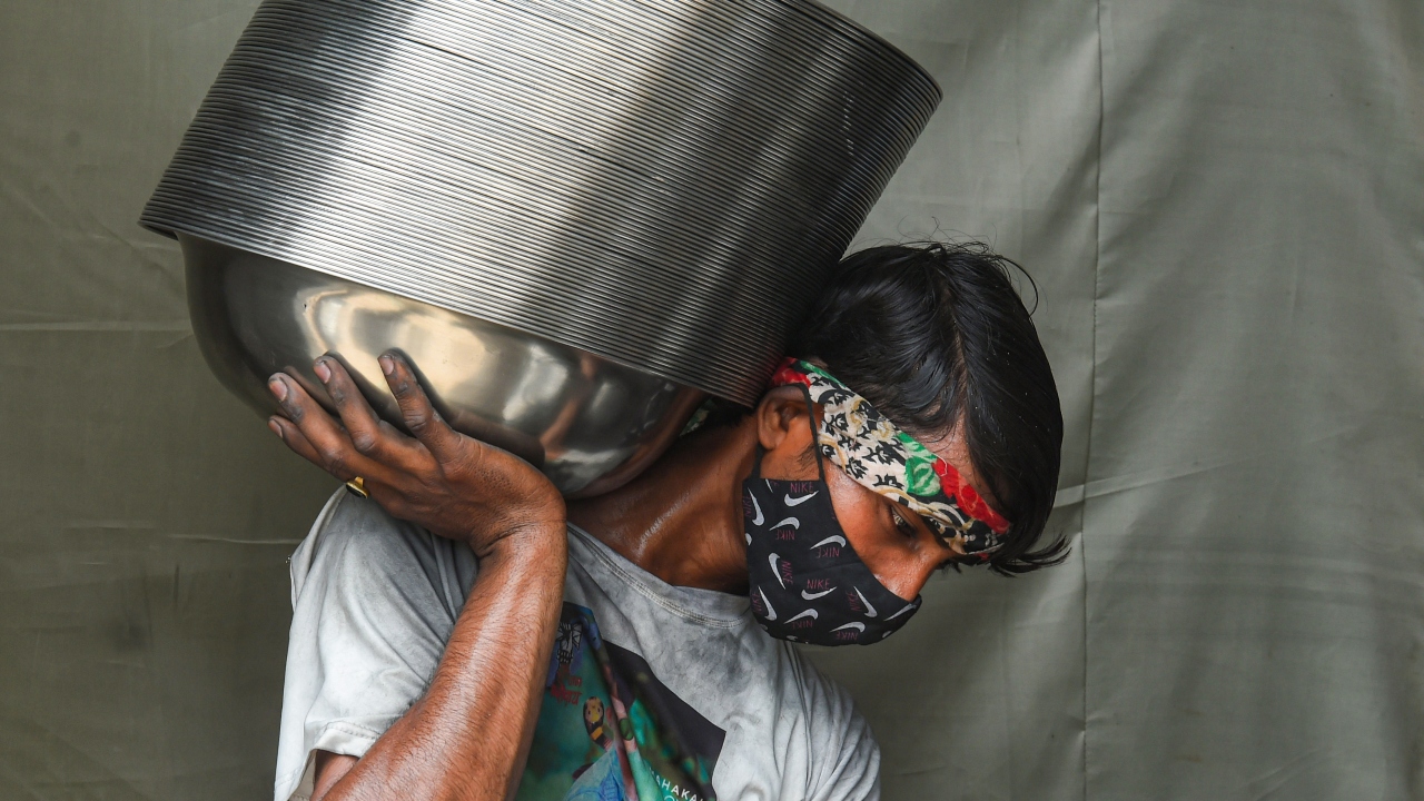 The picture shows a worker busy at a factory in the Wazirpur Industrial area in New Delhi. Credit: PTI Photo