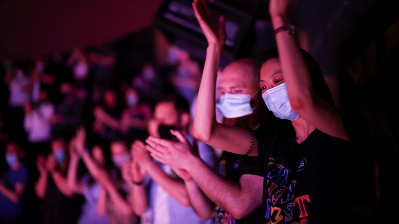 Guests applaud at the end of a performance of the West End show 'The Show Must Go On' at the Palace Theatre, amid the spread of coronavirus in London. Credit: Reuters Photo