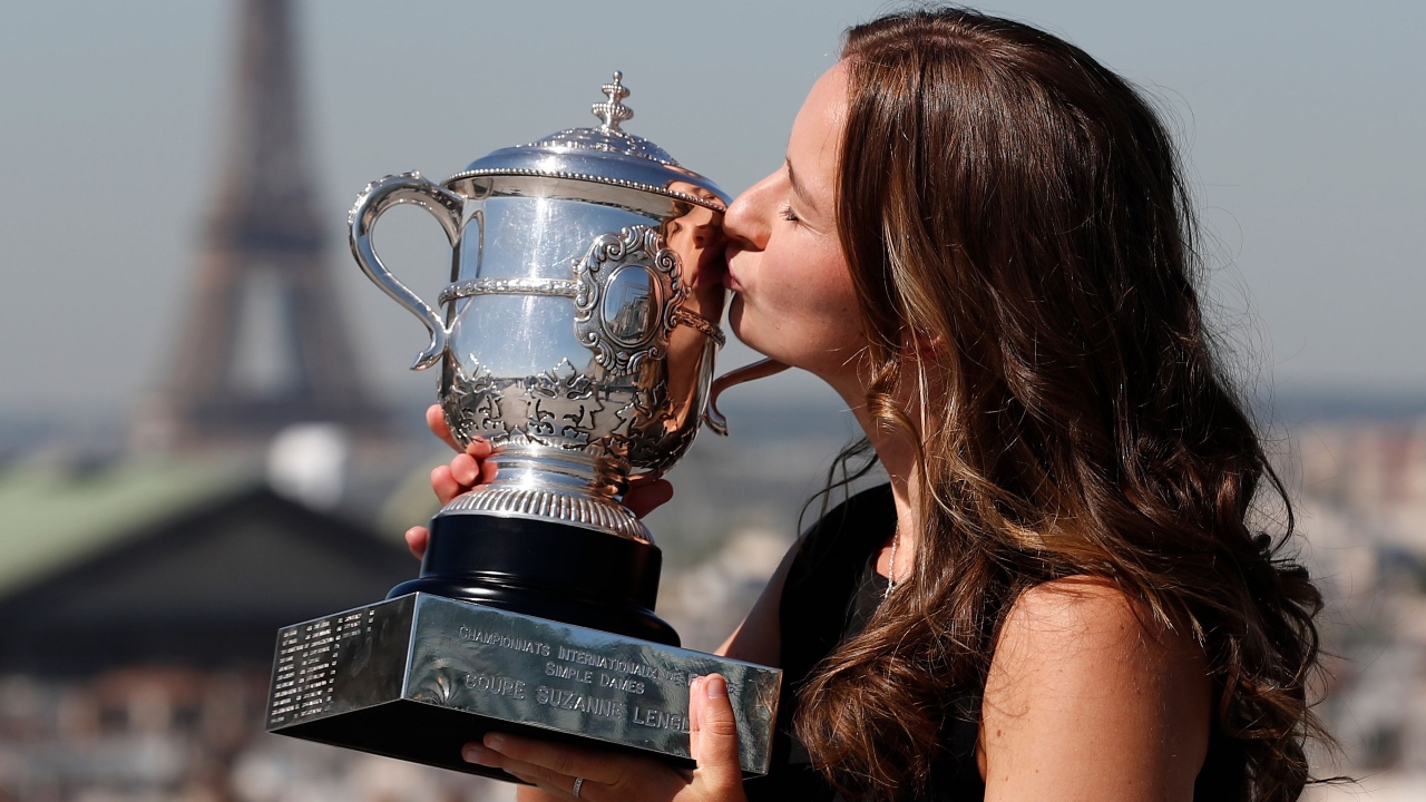 Czech Republic's Barbora Krejcikova poses with the women's singles trophy in front of the Eiffel Tower after winning the French Open. Credit: Reuters Photo