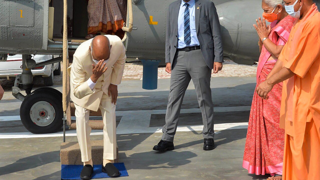 The President reached his village in a chopper and bowed down to touch the soil of his village as a mark of respect.