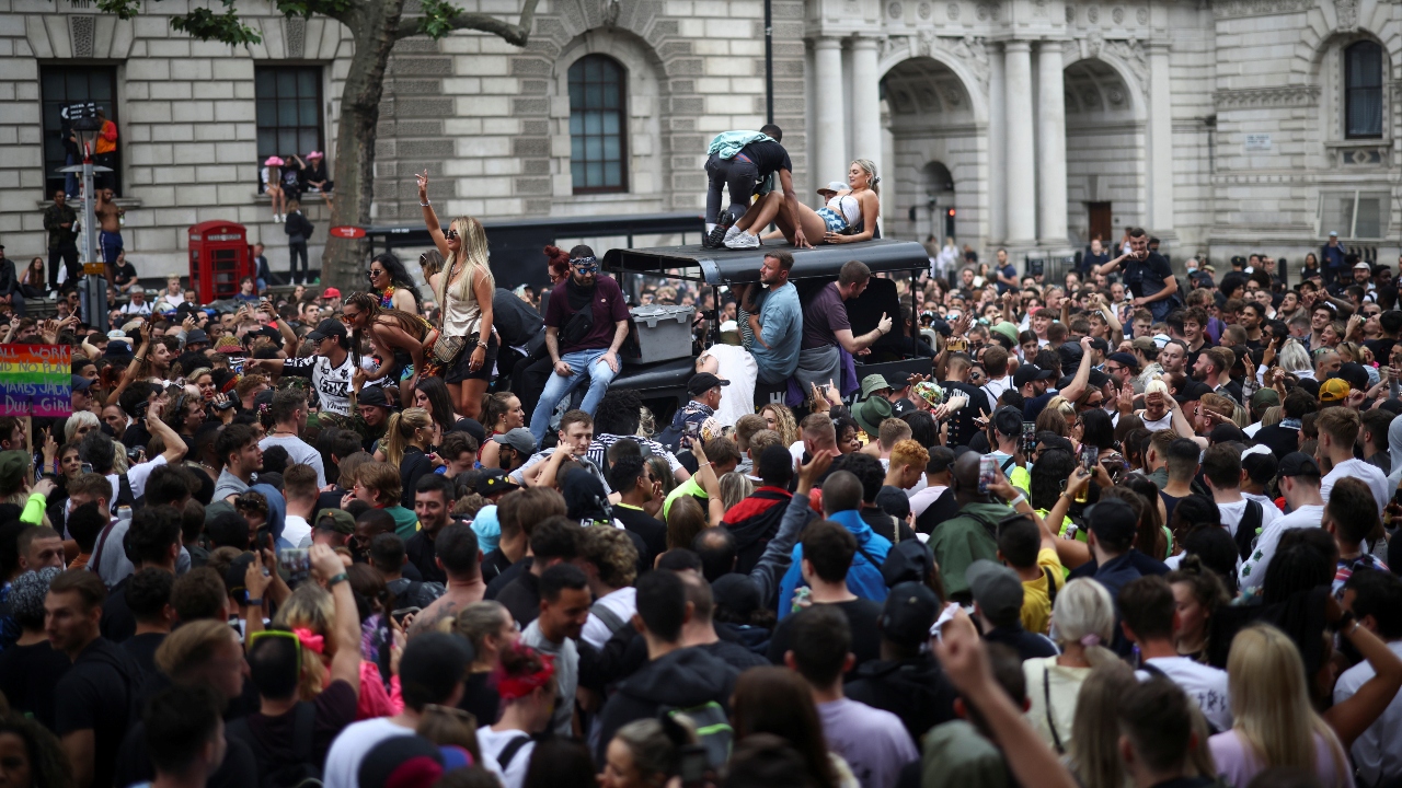 People crowd Downing Street during the 'Save Our Scene' protest in London.