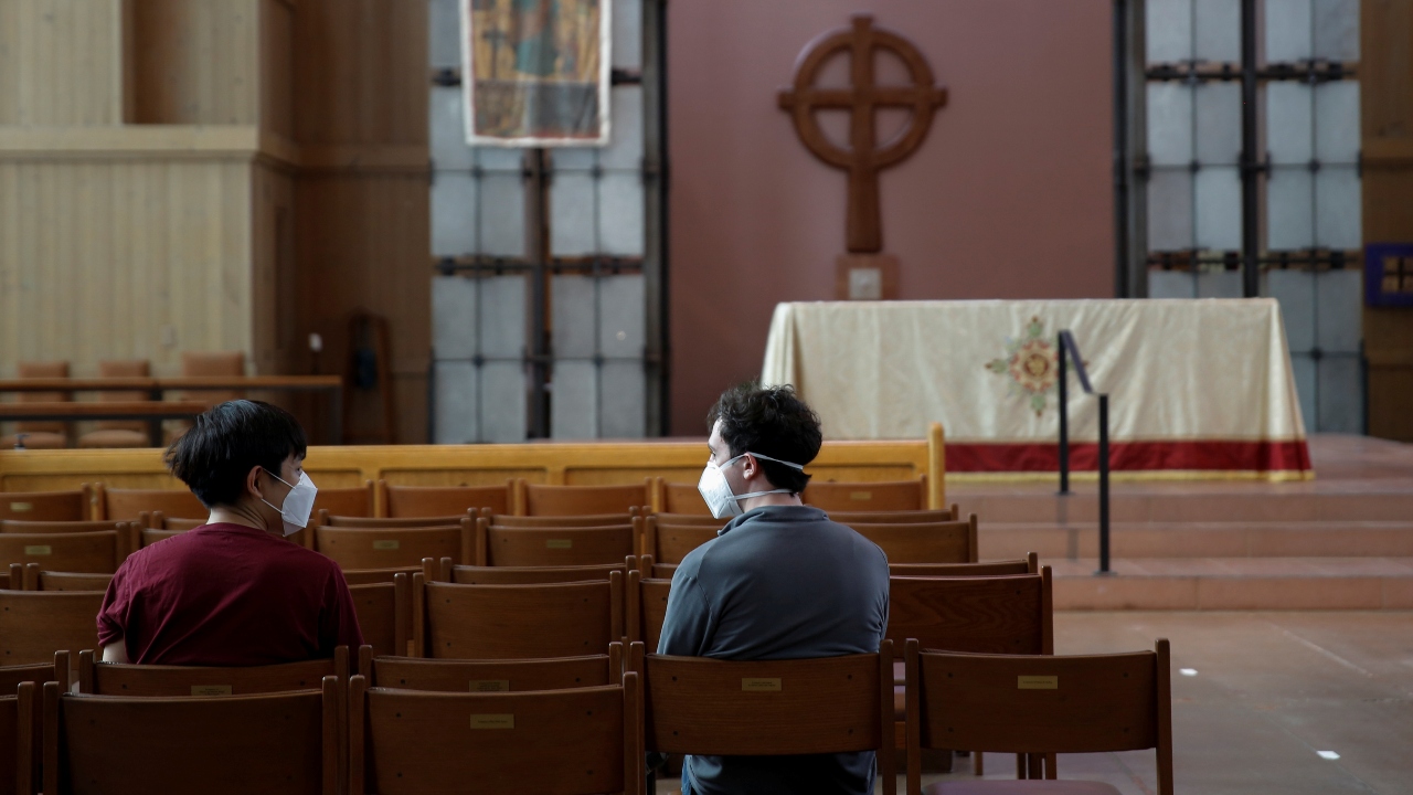 People undergo their waiting period in the pews after being vaccinated against Covid-19, accompanied by live music from an organist, at a clinic held by 6M Geriatrics at Saint Mark's Episcopal Cathedral in the Capitol Hill district of Seattle, Washington. Credit: Reuters Photo