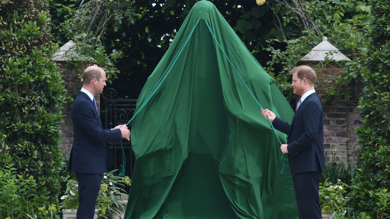 Britain's Prince William, Duke of Cambridge and Britain's Prince Harry, Duke of Sussex unveil a statue of their mother, Princess Diana at The Sunken Garden in Kensington Palace, London.