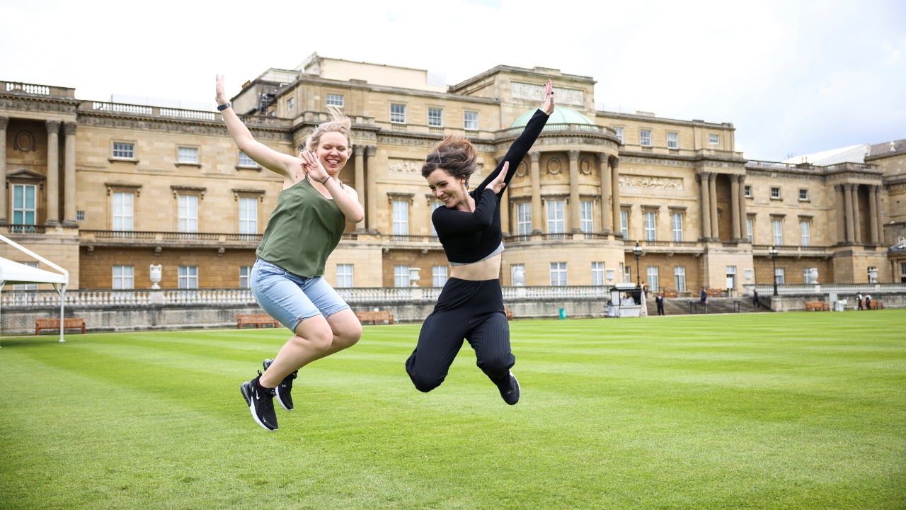Work has been accelerated during the pandemic while the queen has spent most of the her time at her Windsor Castle home outside London. In this photo, People are seen posing for the photographs at the Garden of Buckingham Palace in London.