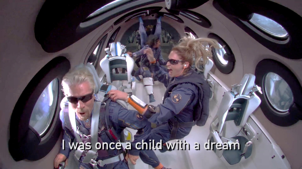 Billionaire Richard Branson makes a statement as crew members Beth Moses and Sirisha Bandla float in zero gravity on board Virgin Galactic's passenger rocket plane VSS Unity after reaching the edge of space. Credit: Virgin Galactic/Handout via Reuters