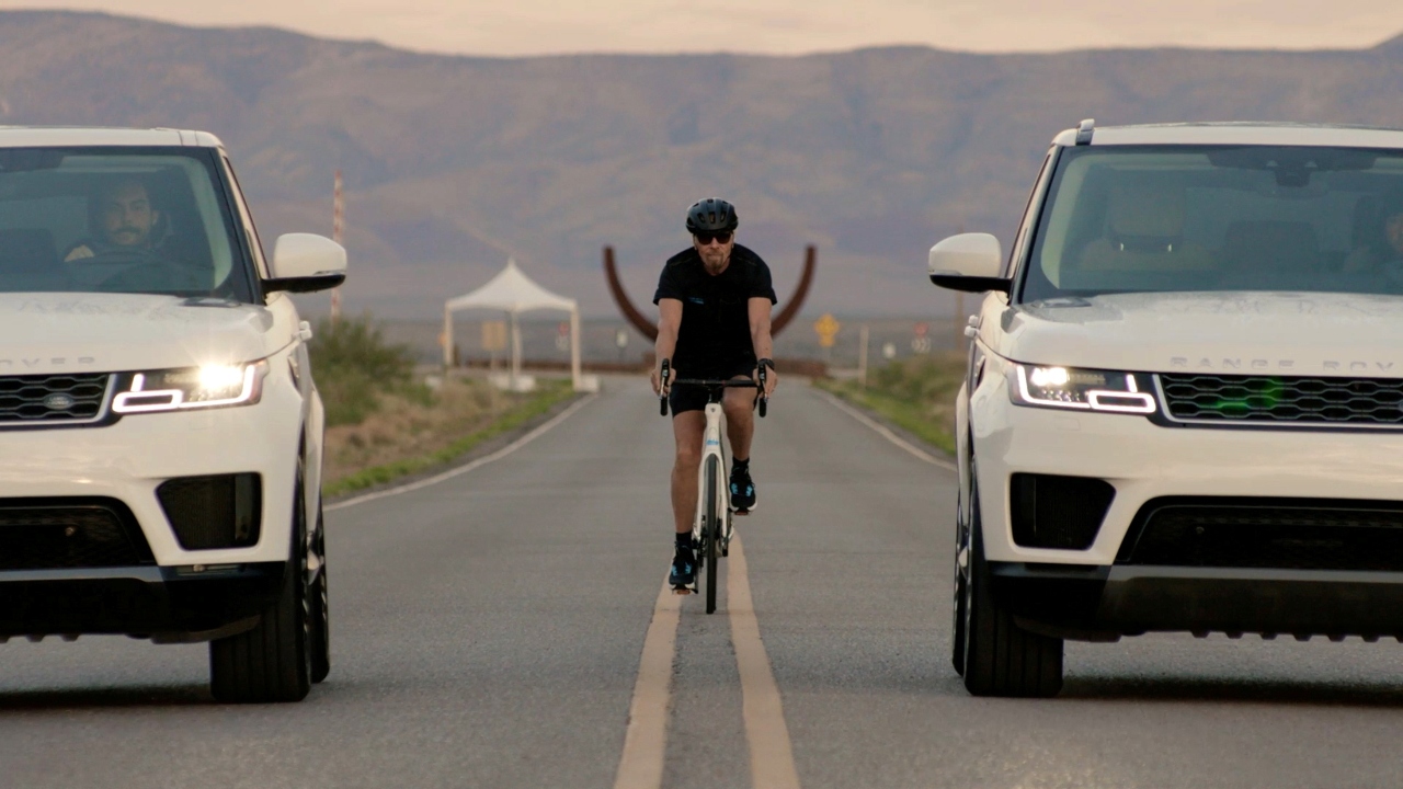 Richard Branson arrives by bicycle to Spaceport America. Credit: Reuters Photo