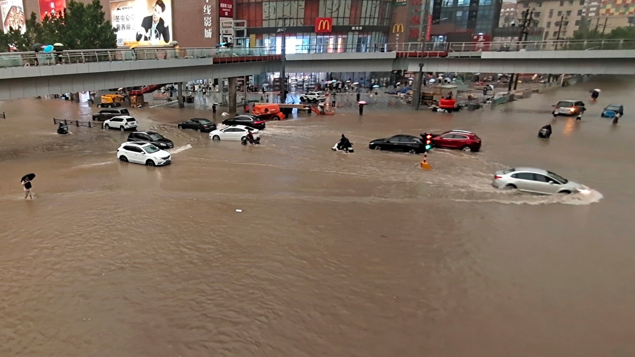 Stranded vehicles after a heavy downpour in Zhengzhou city, central China. Credit: AP Photo