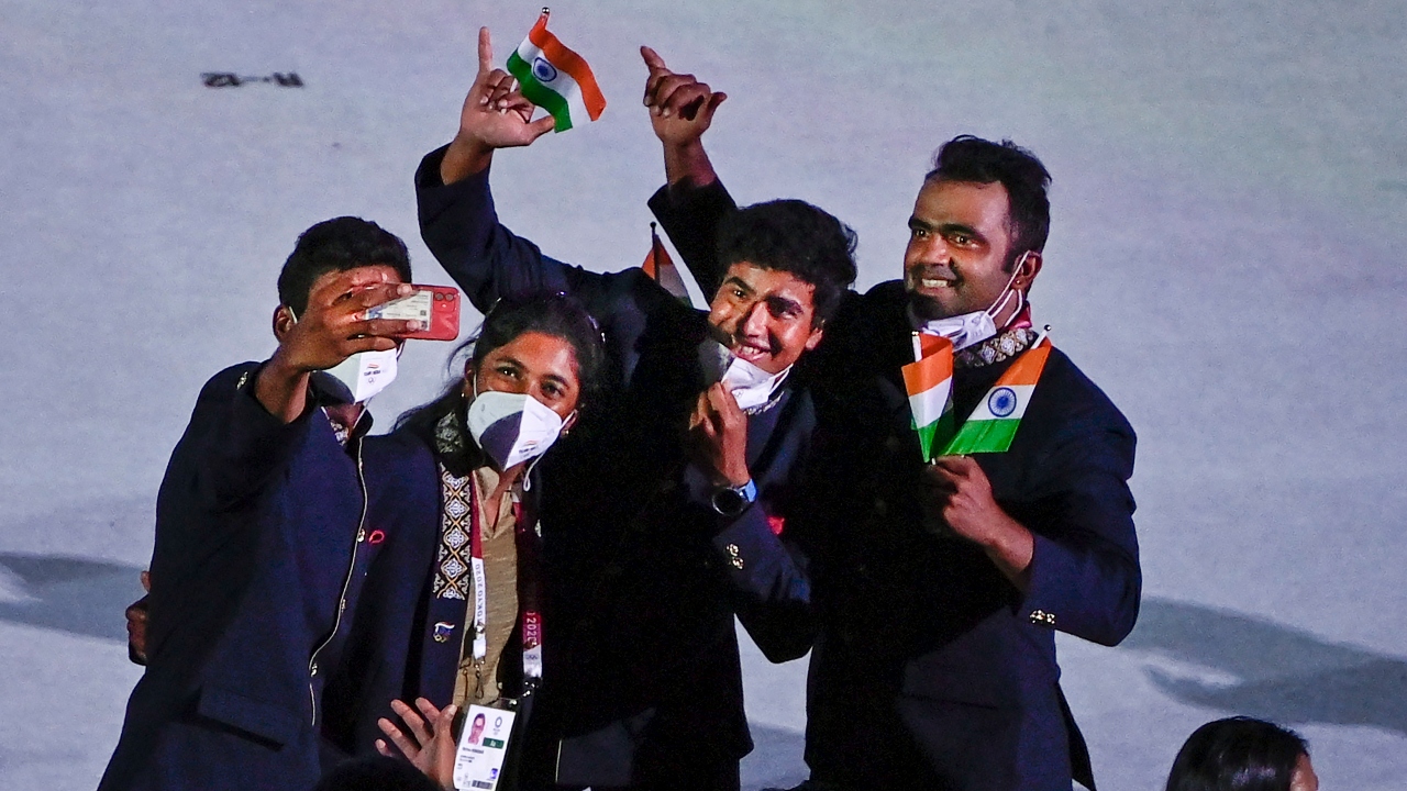 Indian players click selfies at the Olympic Stadium during the opening ceremony of the Summer Olympics 2020 in Tokyo. Credit: PTI Photo
