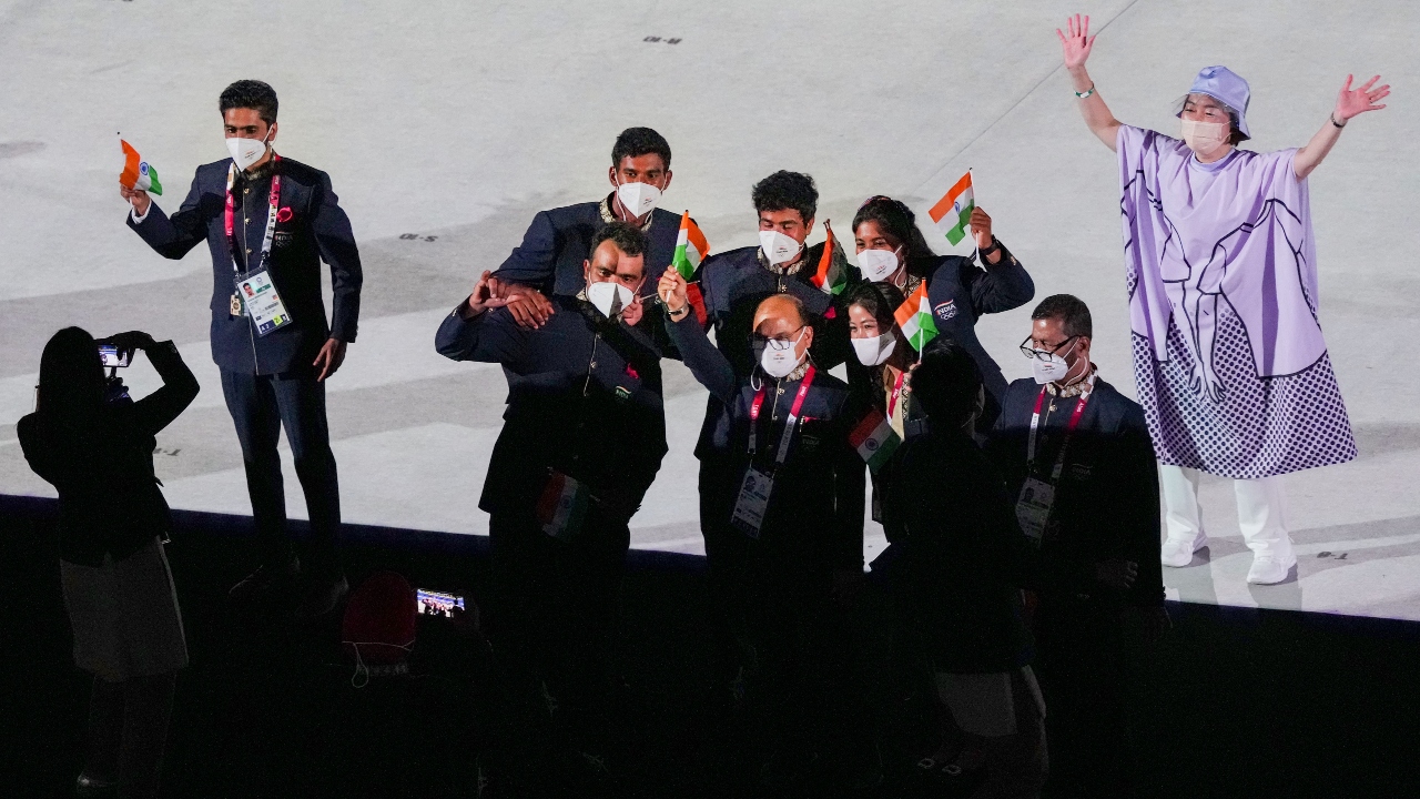 Indian athletes take selfies at the Olympic Stadium during the opening ceremony of the Summer Olympics 2020 in Tokyo. Credit: PTI Photo