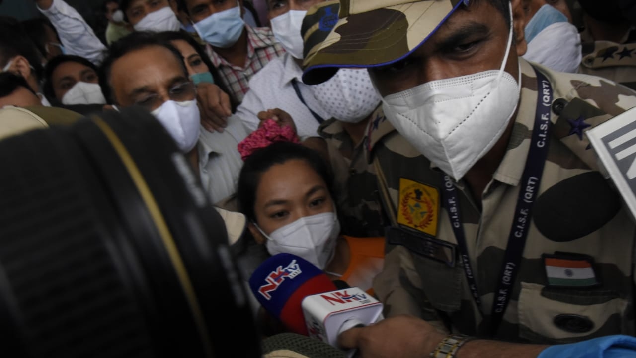 Mirabai Chanu landed with her coach Vijay Sharma at the Delhi Airport on July 26, 2021. Credit: Amlan Paliwal