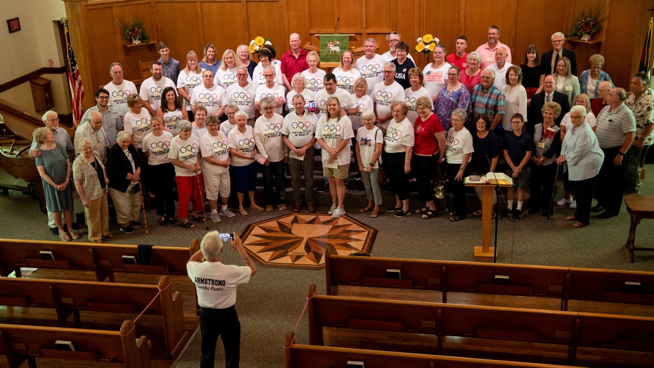 Members of the Dover First Moravian Church cheer for US swimmer Hunter Armstrong. Credit: Reuters Photo