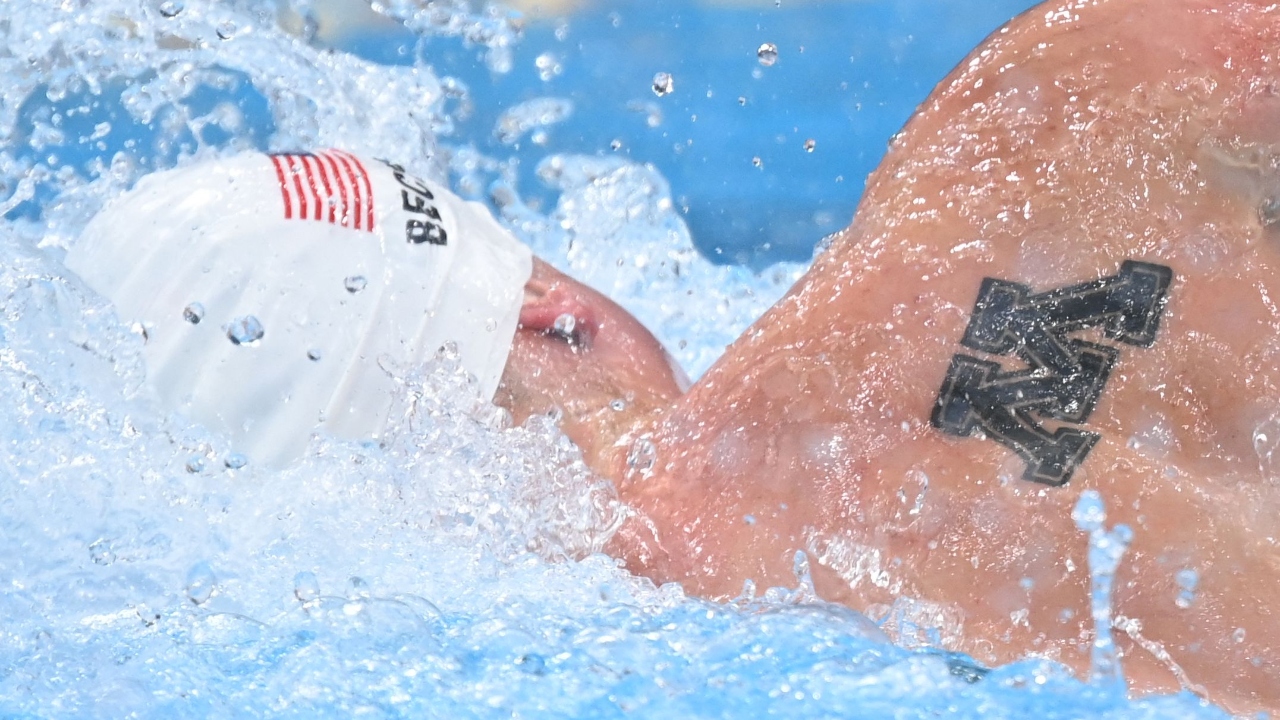 USA's Bowen Becker has a 'M' tatoo on his back. Credit: AFP Photo