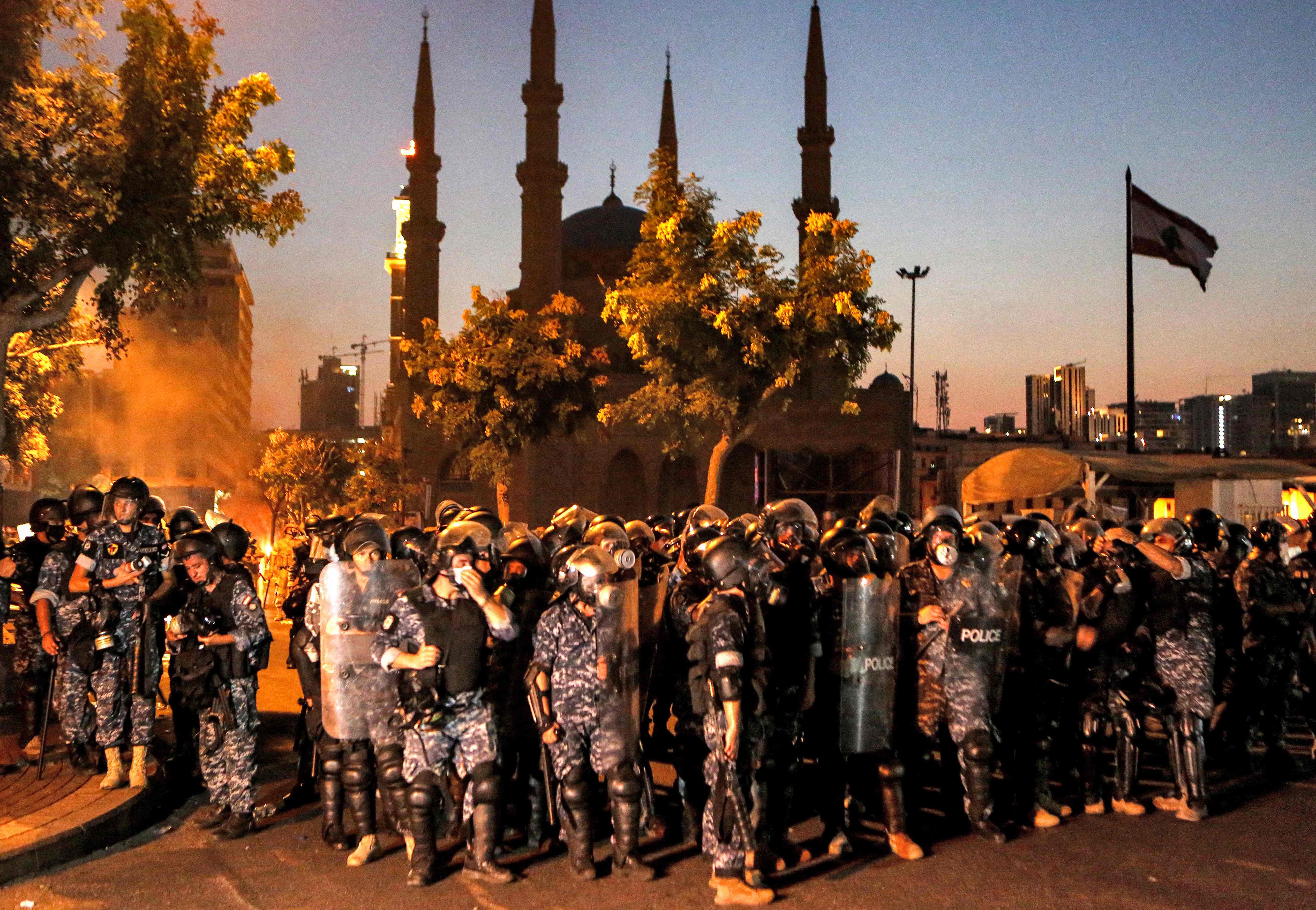 Lebanese riot police deploy near the Lebanese parliament headquarters in the centre of the capital Beirut on August 4, 2021, following clashes with protesters on the first anniversary of the blast that ravaged the port and the city. Credit: AFP Photo