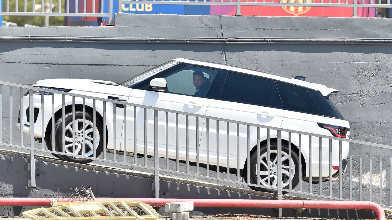 Lionel Messi drives past the Camp Nou stadium in Barcelona on August 8, 2021. Credit: AFP Photo