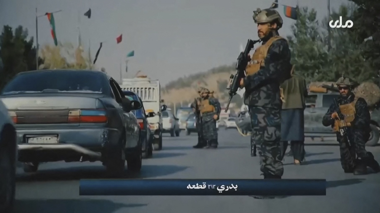 Rather than a battered Russian-designed Kalashnikov rifle slung over their shoulder, the men of