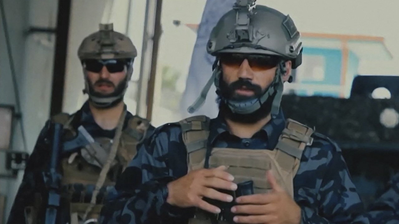 The soldiers are shown in uniforms, boots, balaclavas and body armour similar to those worn by special forces around the world -- and unlike the shalwar kameez, turban and sandals of the traditional Taliban fighter. Credit: AFP Photo