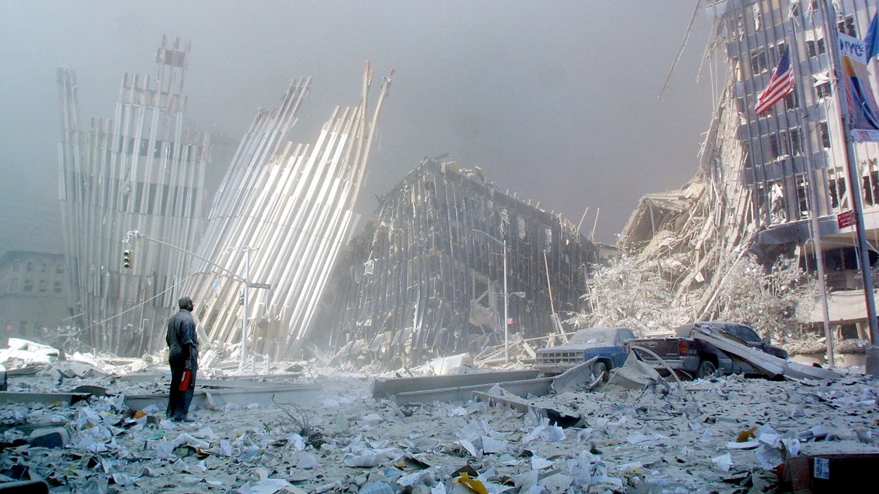 A man stands in the rubble, and calls out asking if anyone needs help, after the collapse of the first of the twin towers of the World Trade Center Tower. Credit: AFP/File Photo